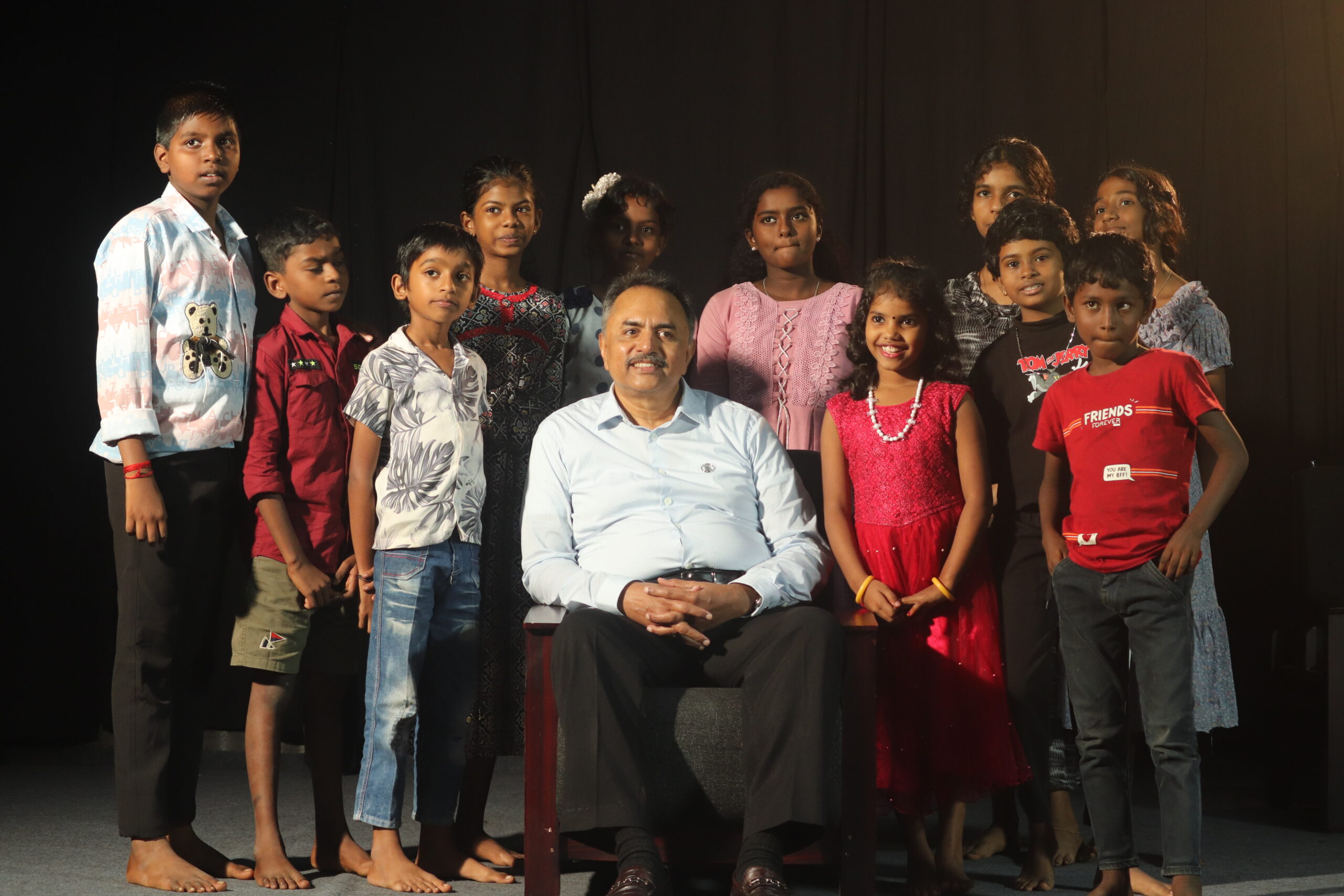 Founder Dr. Mathew Kuruvila sharing joyful moments with our sponsored children